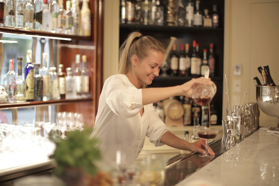 Professional staff serving refreshments at an elegant bar